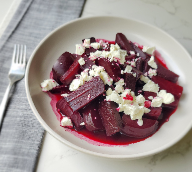 cooked red beets with crumbled goat cheese