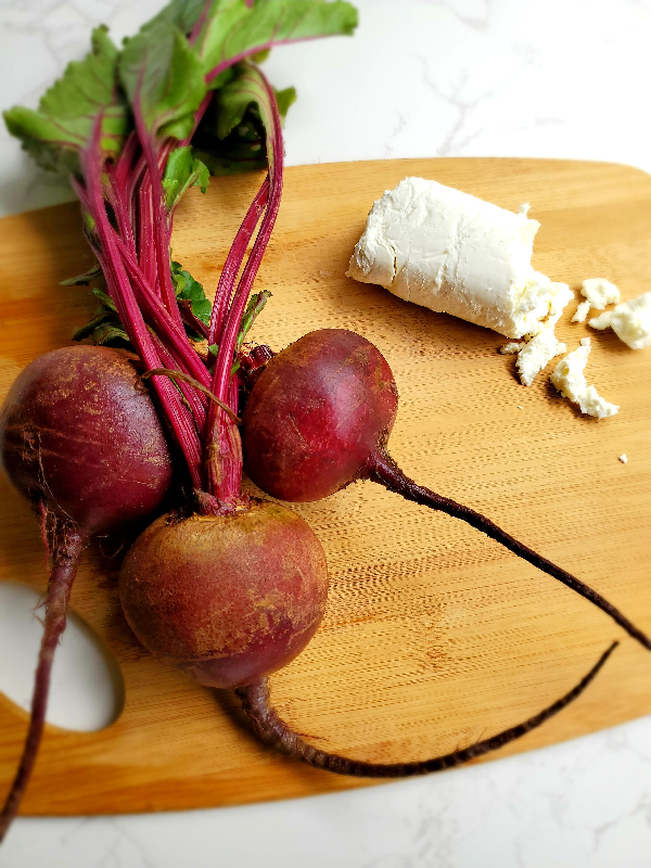 fresh red beets and a log of white goat cheese