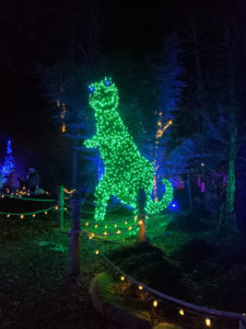 dinosaur wrapped in christmas lights