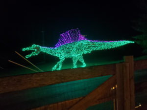 Dinosaur wrapped in christmas lights