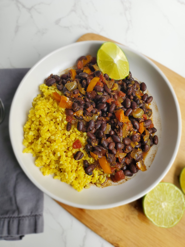 tender black beans served over a bed of rice