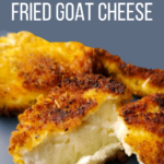 a slice of freshly fried goat cheese broken open to show the creamy inside of the goat cheese in contrast to the crispy fried coating