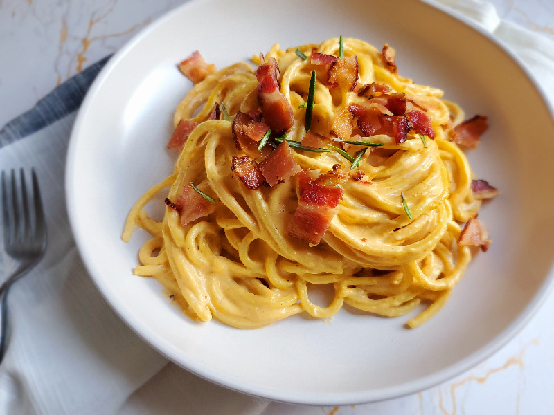 pumpkin goat cheese alfredo topped with bacon and rosemary