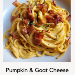 Creamy orange pumpkin alfredo pasta topped with bacon and rosemary