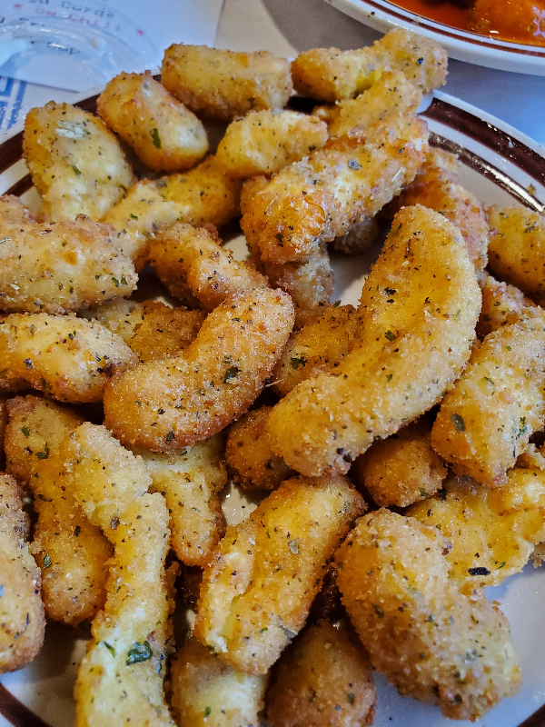 fried cheese curds on a plate