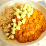 creamy red lentils served over rice with diced cucumbers