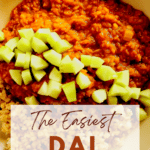 Creamy red lentils served over rice topped with diced cucumber