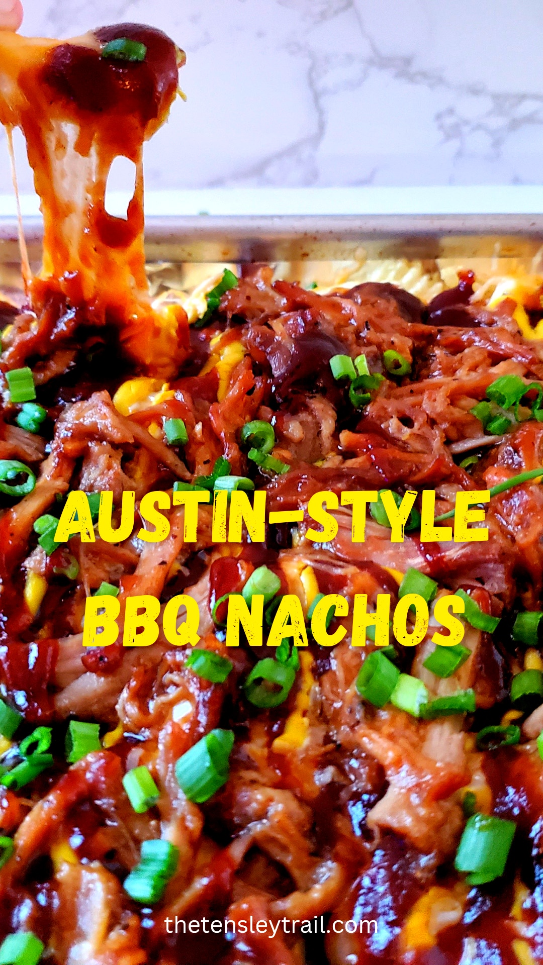 Salty potato chips topped with sweet BBQ sauce, mustard, cheese, and pulled pork make Austin-Style BBQ Nachos the new greatest appetizer!