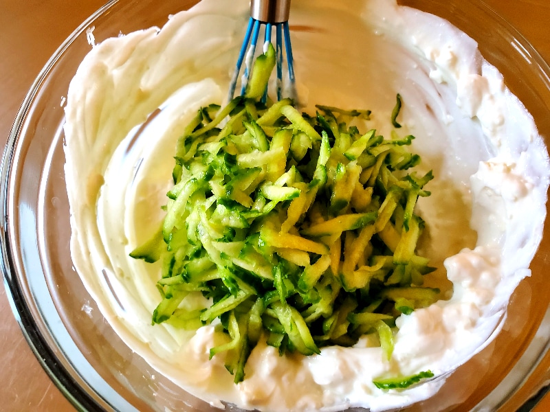 freshly grated cucumber about to be mixed into greek yogurt