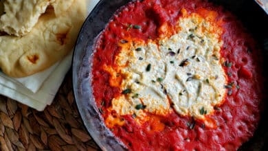 Creamy goat cheese surrounded by marinara sauce